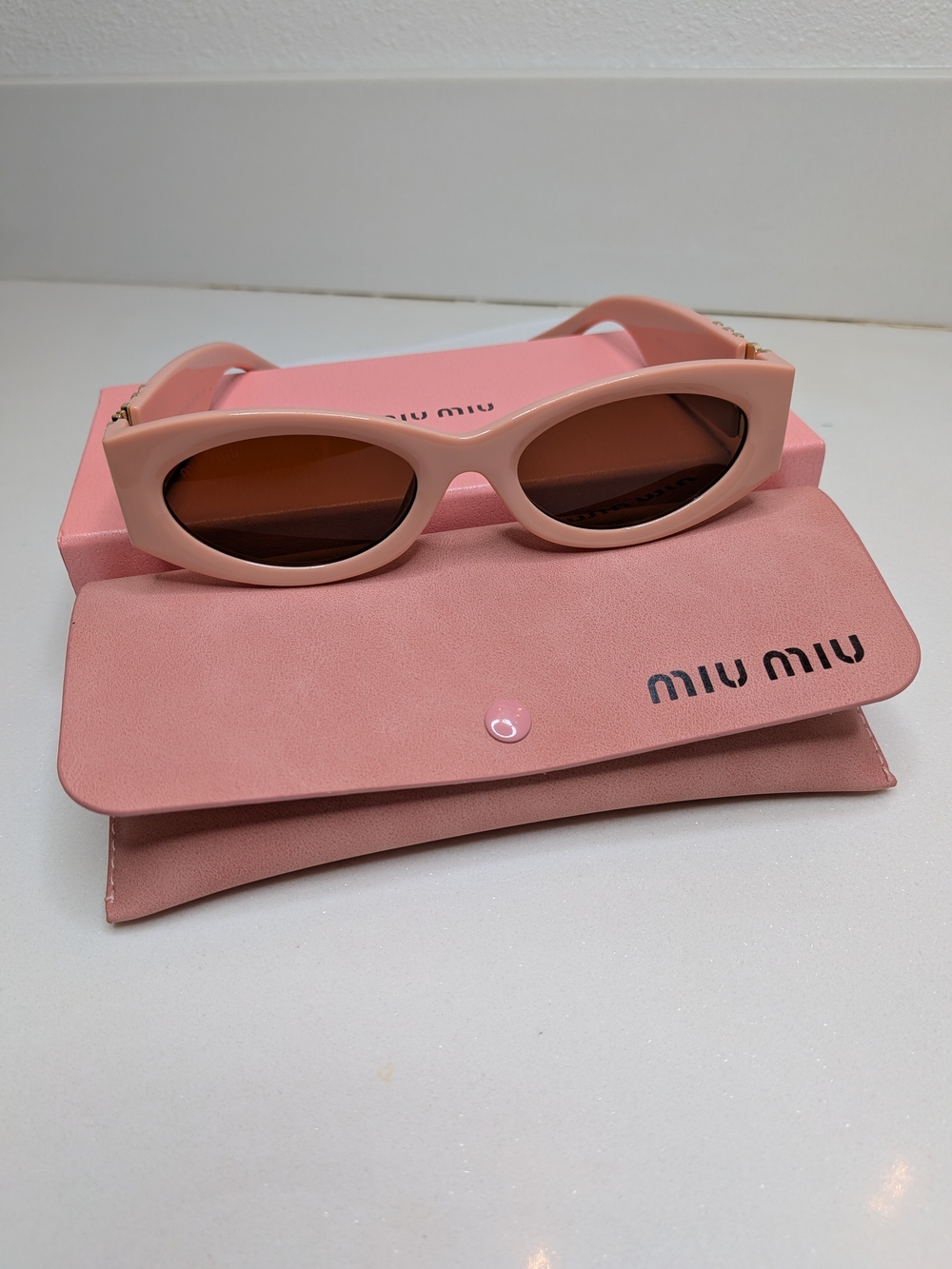 Miu Miu Pink Cat-Eye Sunglasses with Gold Logo Accent - Picture 2 of 12